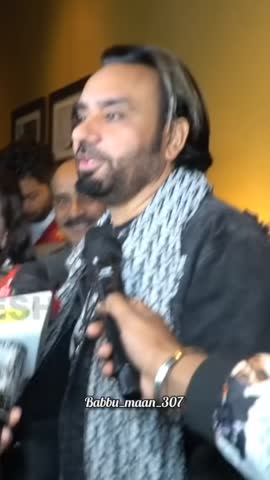 Babbu Mann talking to reporters on his views on his lyrics.